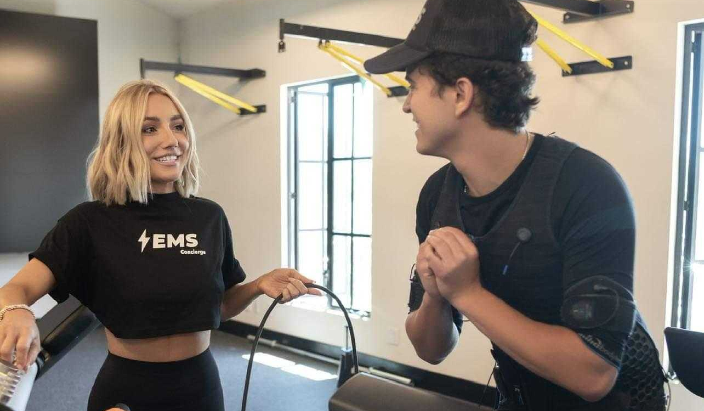 A female trains a male with EMS cardio