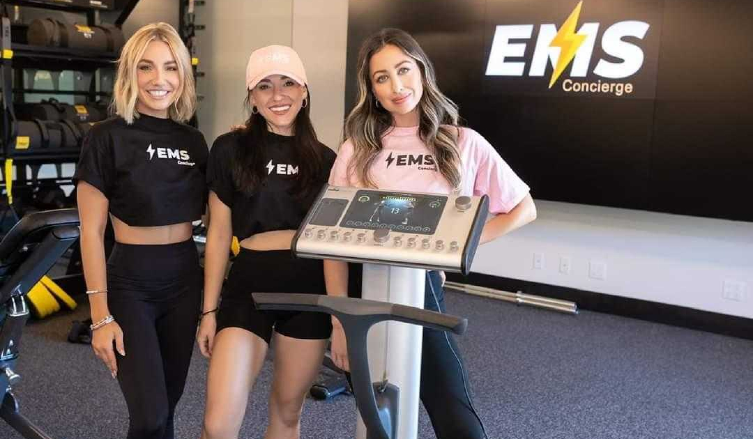 3 women with EMS machine in gym
